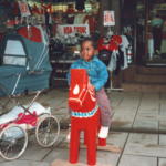 A Black child on a Dale horse.