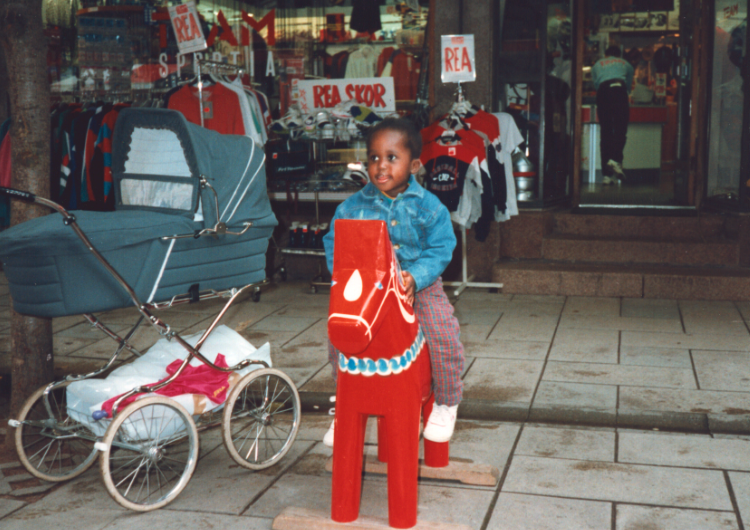 A Black child on a Dale horse.