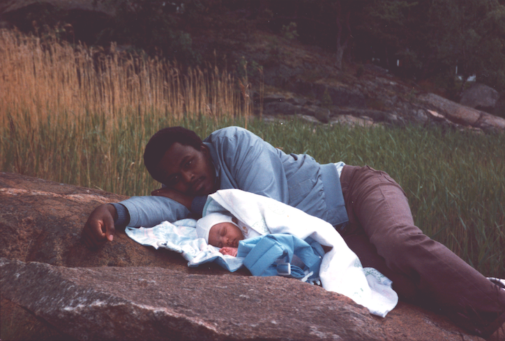 An image of a black dad and his newborn baby